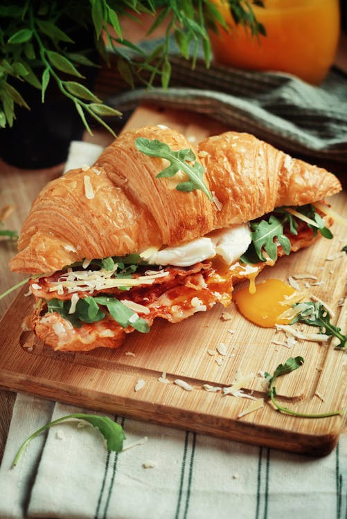 A bacon croissant sandwich