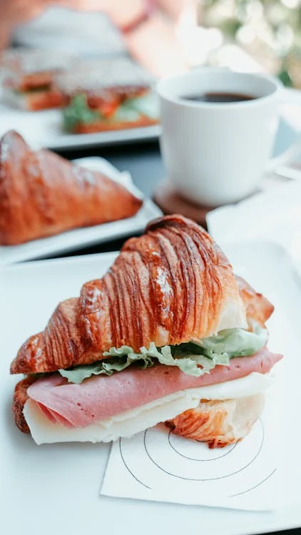 A ham croissant sandwich