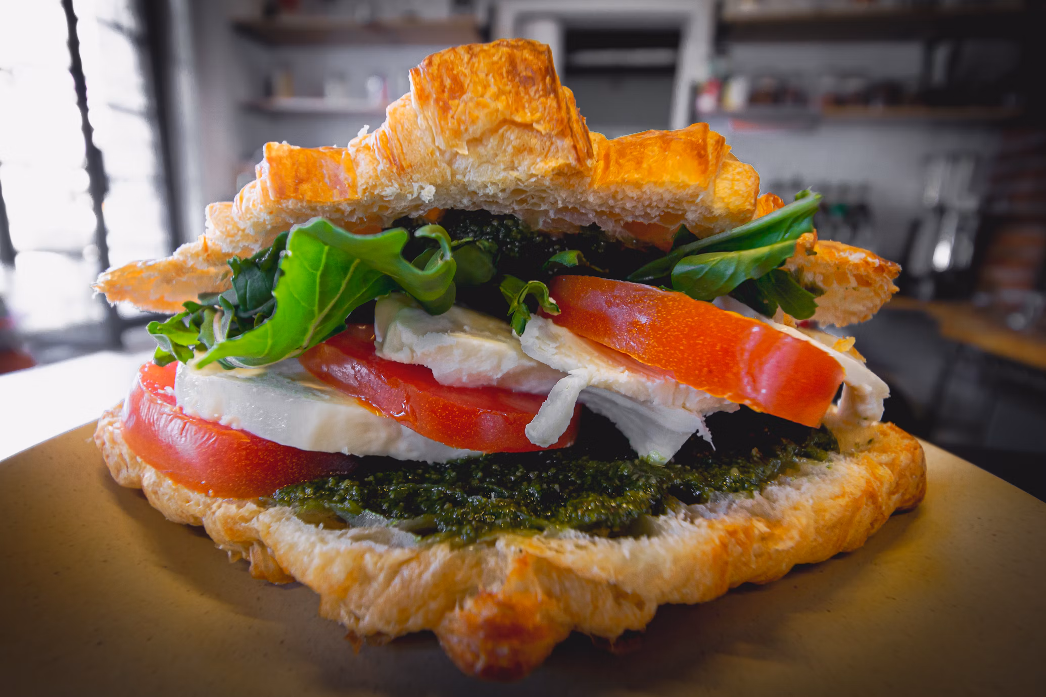 A vegetable croissant sandwich